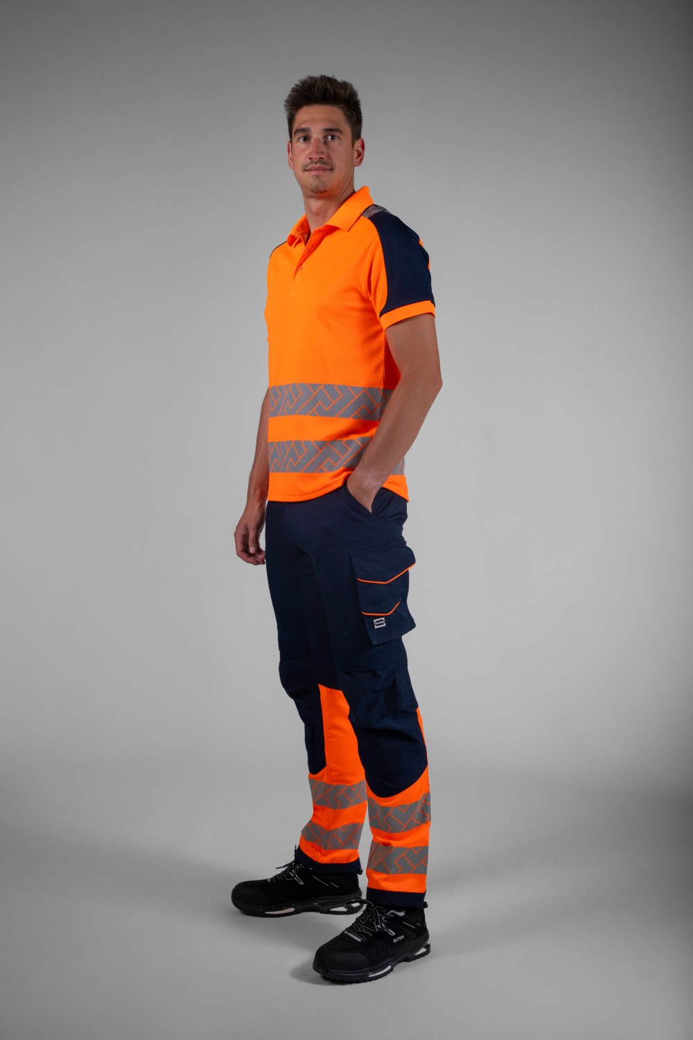 TRICORP Arbeitshose 2-Way Stretch High Vis Redefined in Ink-Fluororange – Modellansicht