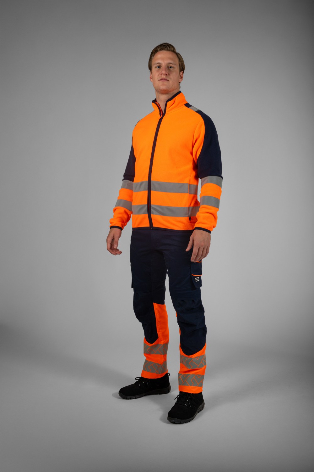 TRICORP Arbeitshose Funktionelle Stretch High Vis Redefined in Ink-Fluororange – Modellansicht